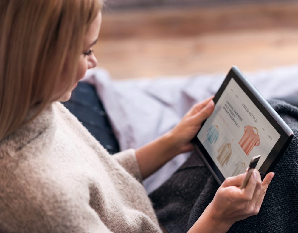 woman shopping on tablet - CPG