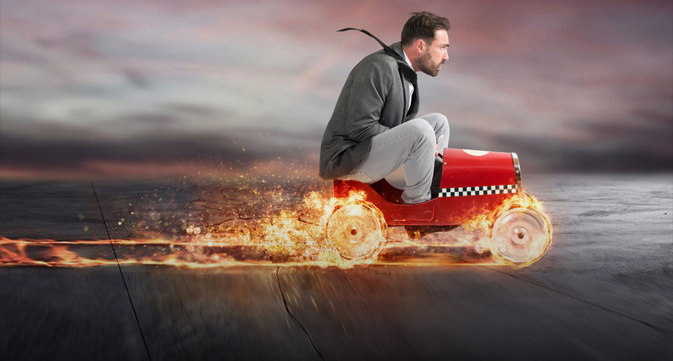 man on a toy car in flame - growth