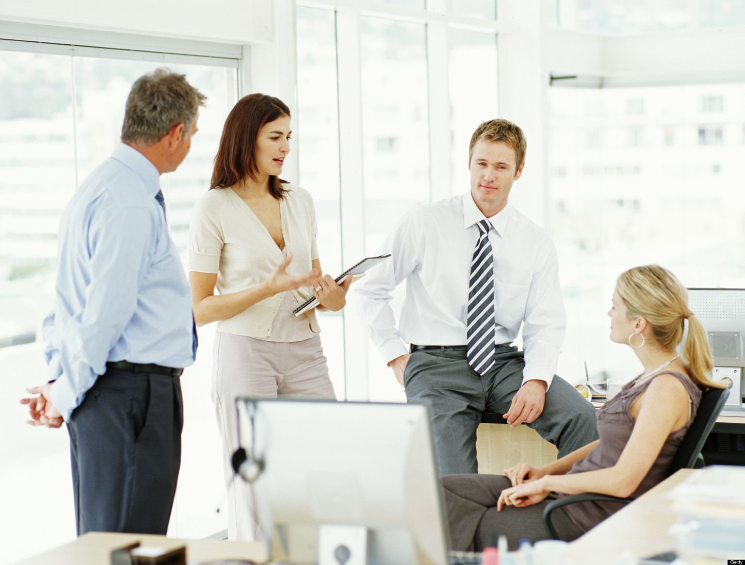 business woman speaking to associates