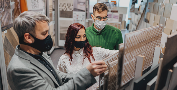 A young couple looking at flooring samples