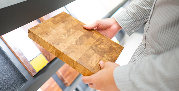 Male shopper looking at a floor sample